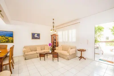 a living room with two couches and a table at Family Getaway Home in Rhodes Town
