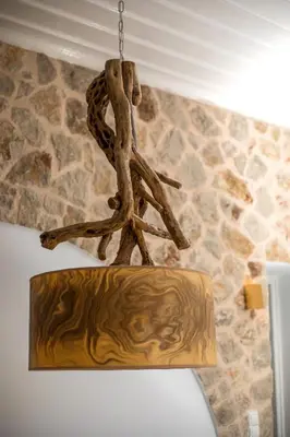 a chandelier hanging from the ceiling in a room at Lady Stamatias House in Halki