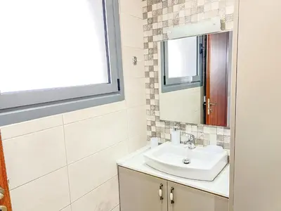 a bathroom with a sink and a mirror at La Casa di villagio in Koskinou