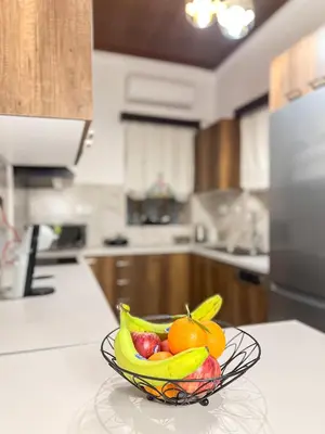 a bowl of fruit on a counter in a kitchen at La Casa di villagio in Koskinou