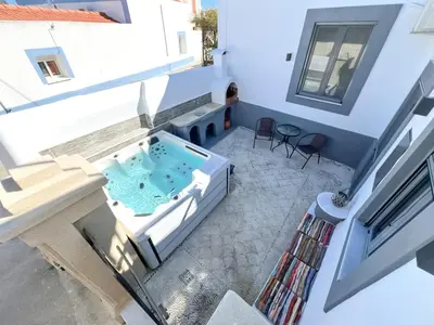 a hot tub in the middle of a building at La Casa di villagio in Koskinou