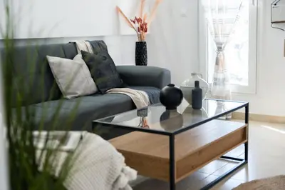 a living room with a couch and a coffee table at Ismini Luxury Villa in vlicha