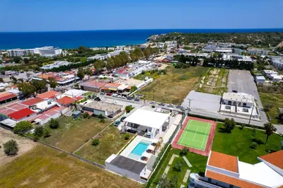 an aerial view of a city with a tennis court at JOHANNES LUXURY VILLAS in Kolimbia
