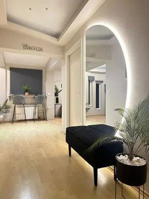 a living room with a bed and a table at Coral Paradise Luxury Modern Family Villa with Jacuzzi, Pool View & Parking in Rhodes Island in Kremasti