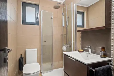 a bathroom with a toilet and a sink and a shower at Casa Di Natalia in Rhodes Town