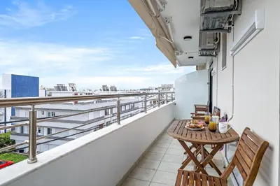 a balcony with a table and chairs on a building at Casa Di Natalia in Rhodes Town