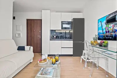 a living room with a white couch and a table at Casa Di Natalia in Rhodes Town
