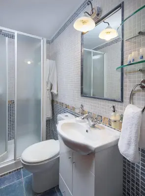 a bathroom with a sink and a toilet and a shower at Villa Haraki Paradise in Haraki
