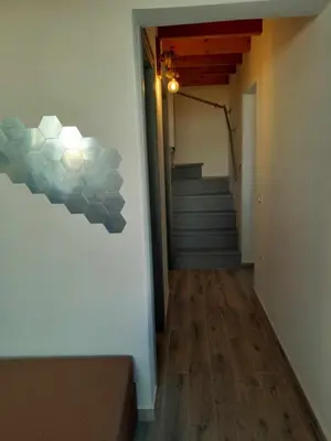 a hallway with a staircase and a stair case at 
