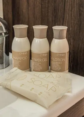 three bottles of chai over gel on a shelf at Pearl of Stegna - Beach House in Archangelos