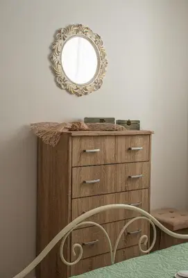 a wooden dresser with a mirror on a wall at Pearl of Stegna - Beach House in Archangelos