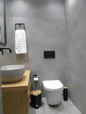 a bathroom with a white toilet and a sink at Amerikis Central Apart in Rhodes Town