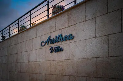 a sign on the side of a building at Arsithea Villa in Monólithos