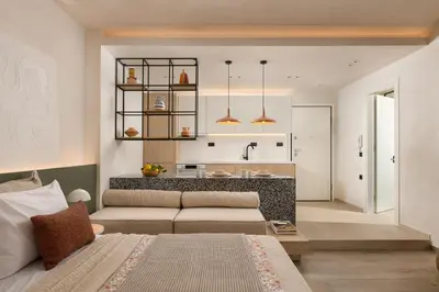 a living room with a bed and a kitchen at HELENA’S RETREAT in Rhodes Town