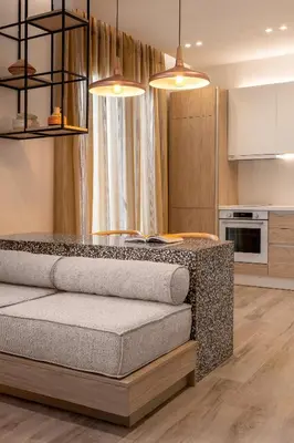 a kitchen with two lights and a table in a room at HELENA’S RETREAT in Rhodes Town