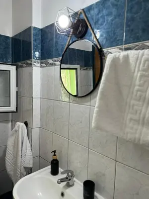 a bathroom with a mirror and a sink at Aesthetic Cozy Haven in Kremasti