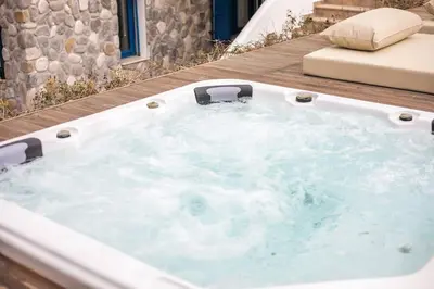 a jacuzzi tub sitting on top of a deck at Villa Kaya in Haraki