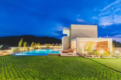 a house with a swimming pool in a yard at Aiolia Villa in Lachania
