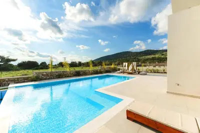 a swimming pool in a villa with a view at Aiolia Villa in Lachania
