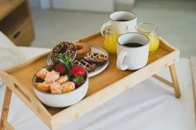 a tray with a plate of food and a cup of coffee at Cleopatras Villa in Lachania