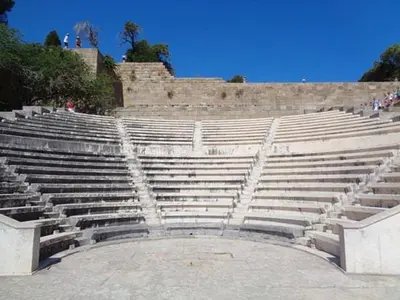 an empty amphitheater with a bunch of concrete seats at Mary's House in Rhodes Town