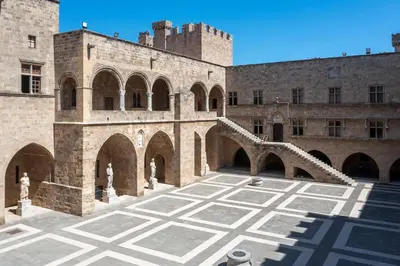 a courtyard of a castle with arches at Mary's House in Rhodes Town