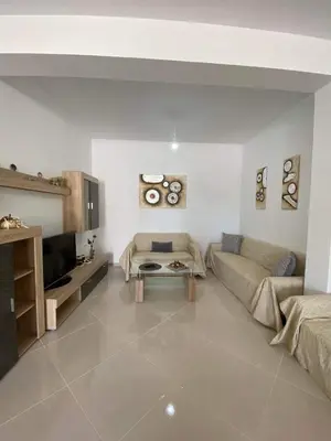 a living room with a couch and a table at Rhodes Volkshaus in Afantou