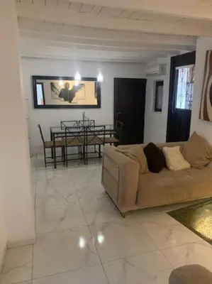 a living room with a couch and a table at Laokoontos 16 in Rhodes Town