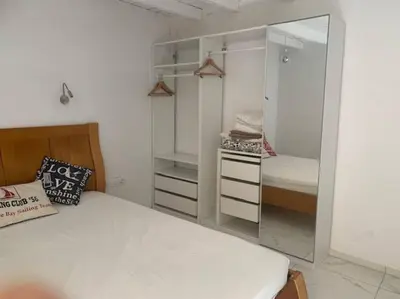 a bedroom with a bed and a mirror at Laokoontos 16 in Rhodes Town