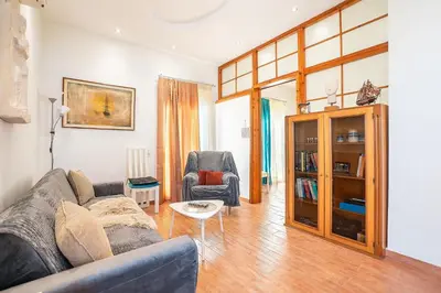a living room with a couch and two chairs at Ciel Rhodes in Rhodes Town