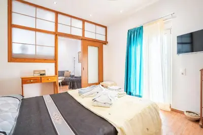 a bedroom with a bed with towels on it at Ciel Rhodes in Rhodes Town