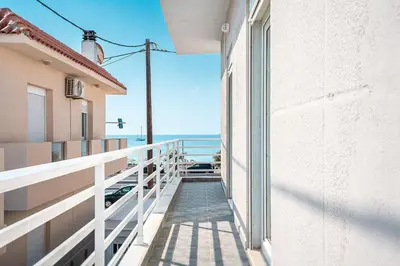 a balcony with a view of the ocean at Ciel Rhodes in Rhodes Town