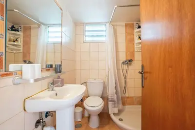 a bathroom with a sink and a toilet and a shower at Ciel Rhodes in Rhodes Town