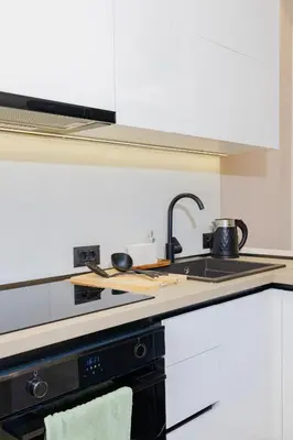 a kitchen with a sink and a counter top at Casa Napais Earth Retreat in Archangelos