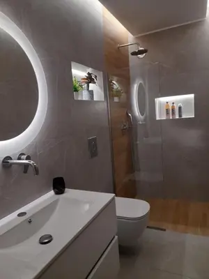 a bathroom with a toilet and a sink and a shower at Prifti Luxury apartment in Faliraki