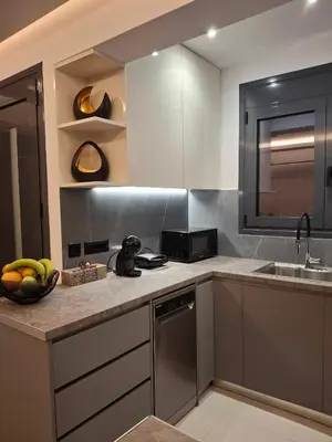 a kitchen with a bowl of bananas on the counter at Prifti Luxury apartment in Faliraki