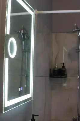 a mirror in a bathroom with a shower at Paradise Apartment, Lardos Village in Lardos
