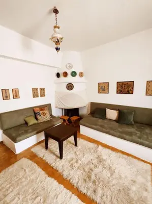 a living room with two couches and a table at Απόλλων in Apóllona