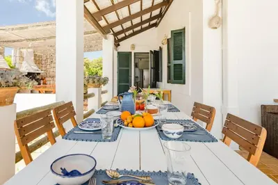 a white table with a bowl of fruit on it at Los Olivos V.I.P Poolvilla Kritinia in Kamiros