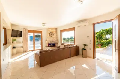 a living room with a couch and a fireplace at Vista Magica in Pastida