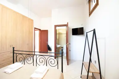 a white room with a bed and a bathroom at Vista Magica in Pastida