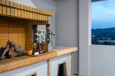 a kitchen with a counter with a sink and a window at Vista Magica in Pastida