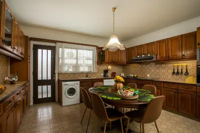 a kitchen with a table with a bowl of fruit on it at Luciana City Apartment in Rhodes Town
