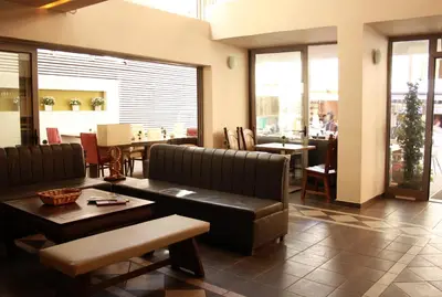 a waiting room with a couch and a table at Svea Hotel in Rhodes Town