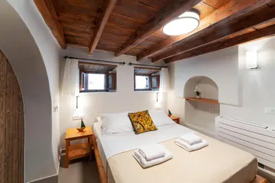 a bedroom with a bed with two towels on it at Rodos Old Town Aqua Luxury House in Rhodes Town