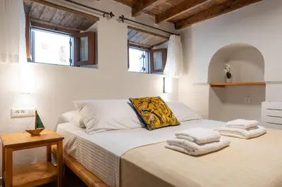 a bedroom with a bed with towels on it at Rodos Old Town Aqua Luxury House in Rhodes Town