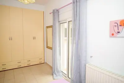a room with a window and a curtain at Pines Villa in Rhodes Town