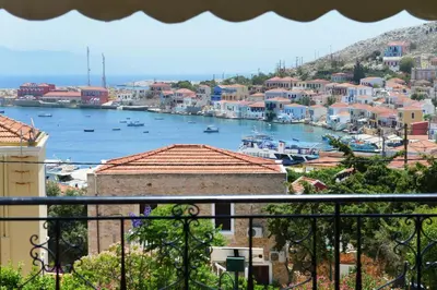 a view of a harbor with boats in the water at Captain Ilias House Chalki in Halki