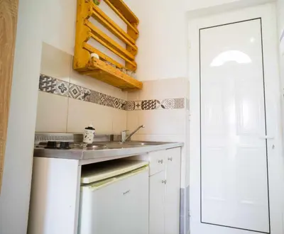 a kitchen with a sink and a counter top at Farkia Exclusive Studios in Faliraki