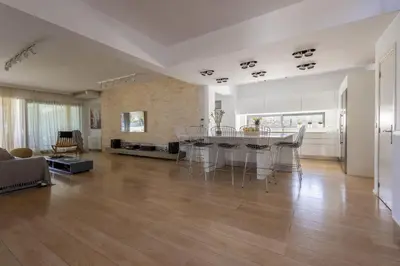 a large living room with a table and chairs at RLM Prime Beach Panoramic Villa in Kolimbia